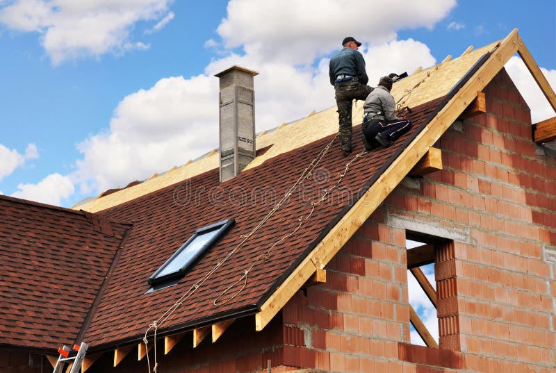Roofers installing residential shingles
